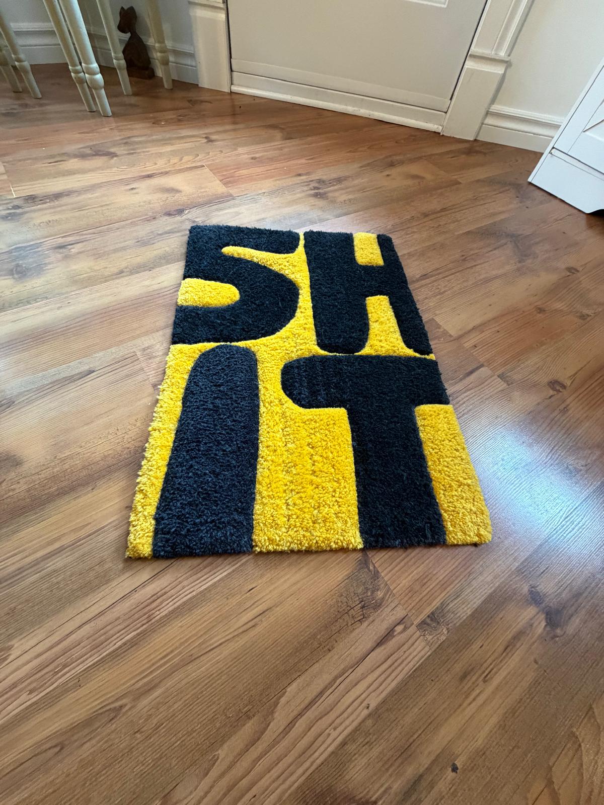 Hand-tufted typography statement rug in yellow and black