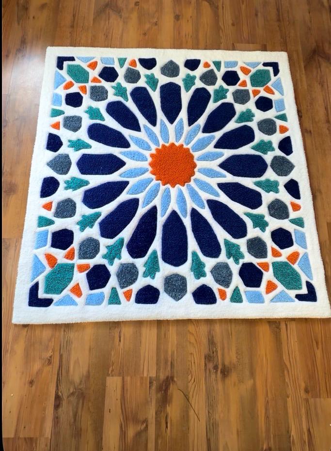 Hand-tufted Moroccan mosaic rug in navy, blue, teal and orange on ivory, full view