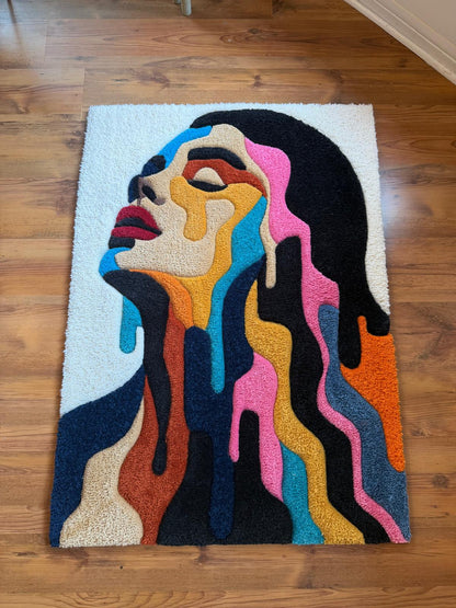 Hand-tufted portrait rug of a woman's face melting into colourful drips, full view